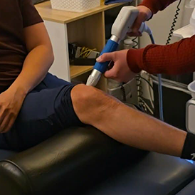Close-up image of shockwave treatment for the knee at Dennis Family Wellness Center in Plano, TX