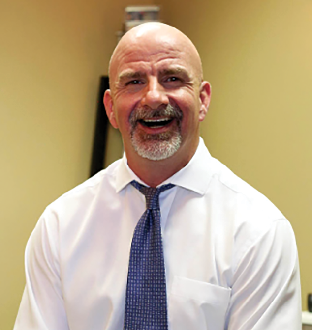 Dr. Joe Dennis, DC, chiropractor and certified acupuncturist at Dennis Family Wellness Center in Plano, TX