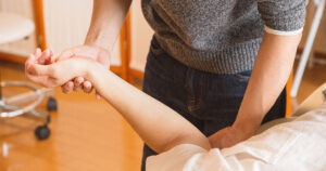 Plano patient consulting with a chiropractor to evaluate the best provider for their care